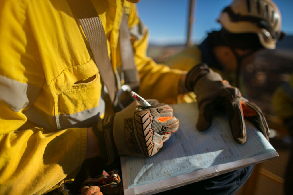 Construction worker filing out paperwork